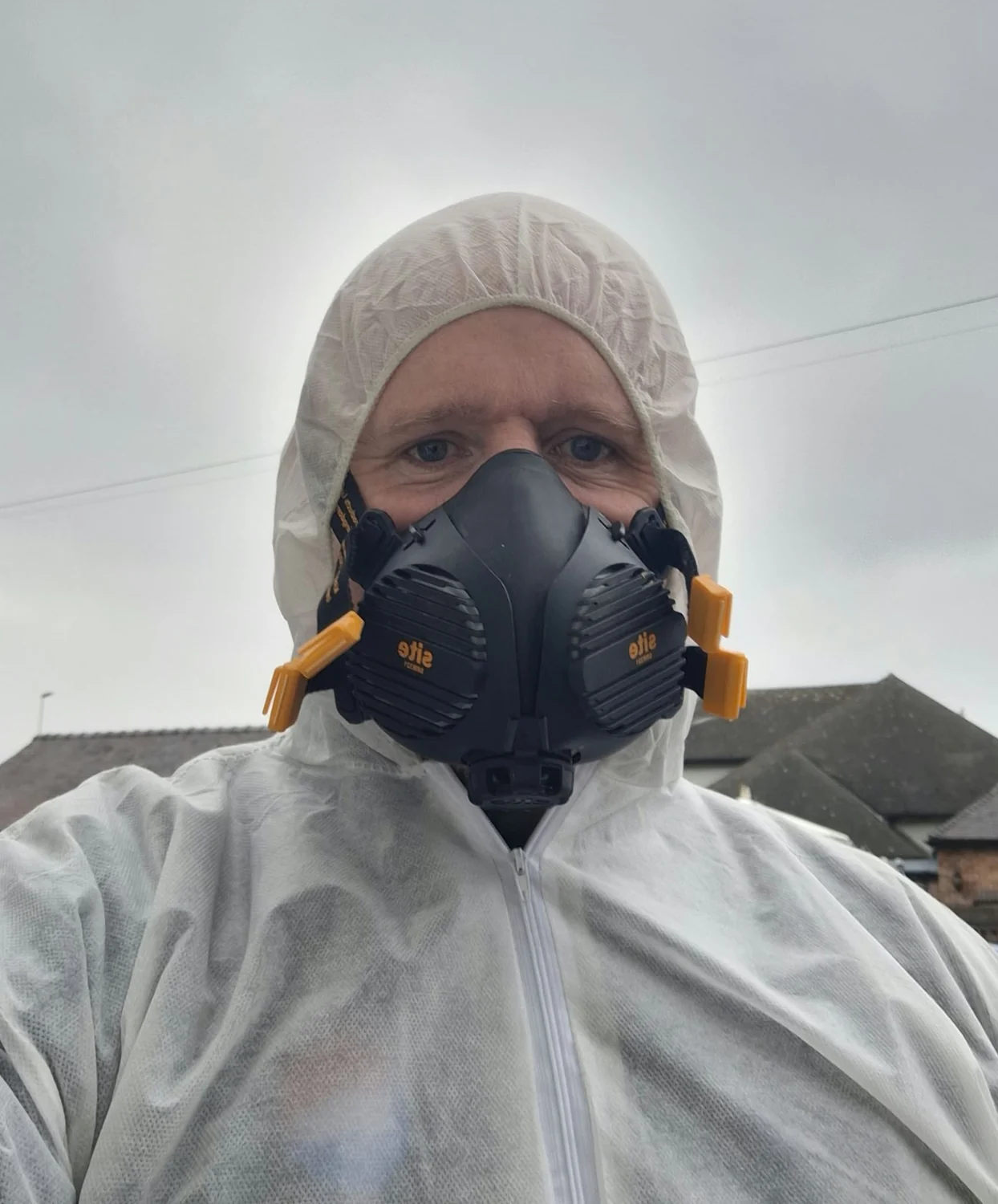 Pest control specialist wearing protective equipment